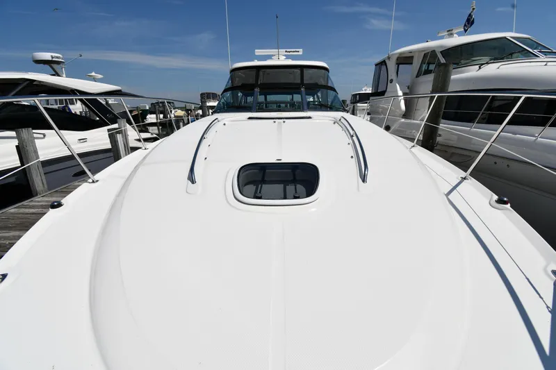 Day Off Yacht Photos Pics 2009 Sea Ray 40 Sundancer yacht docked at marina under clear blue sky.