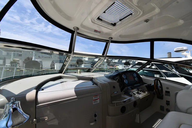 Day Off Yacht Photos Pics Interior view of 2009 Sea Ray 40 Sundancer yacht cockpit with modern controls.