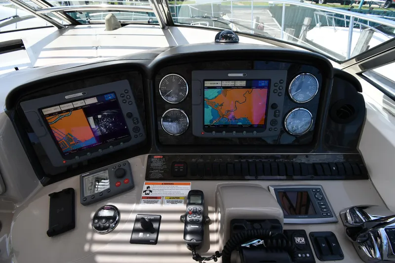 Day Off Yacht Photos Pics Control panel of 2009 Sea Ray 40 Sundancer with navigation screens and gauges.