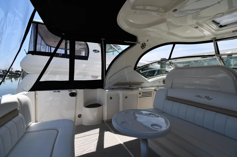 Day Off Yacht Photos Pics Interior of 2009 Sea Ray 40 Sundancer yacht with seating and table.
