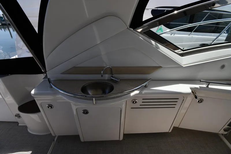 Day Off Yacht Photos Pics 2009 Sea Ray 40 Sundancer yacht interior with sink and storage cabinets.