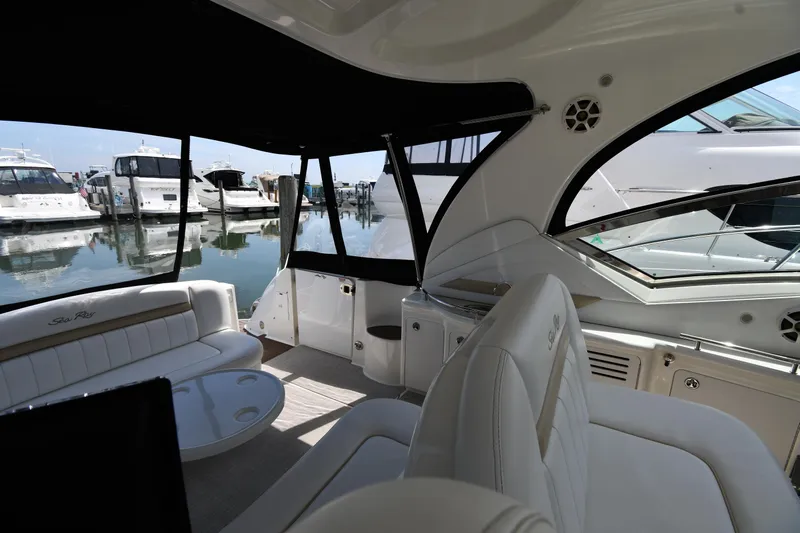 Day Off Yacht Photos Pics Interior of 2009 Sea Ray 40 Sundancer yacht at marina, featuring luxurious seating and sleek design.