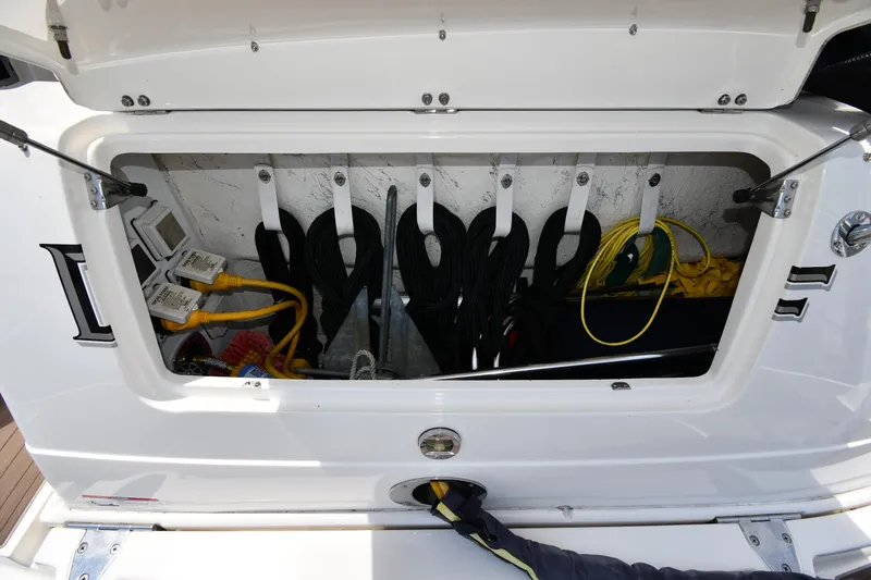 Day Off Yacht Photos Pics Storage compartment of a 2009 Sea Ray 40 Sundancer with ropes and cables neatly organized.