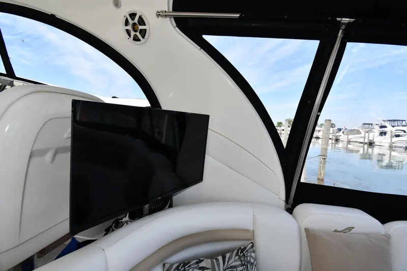 Day Off Yacht Photos Pics Interior of 2009 Sea Ray 40 Sundancer yacht with TV and marina view.