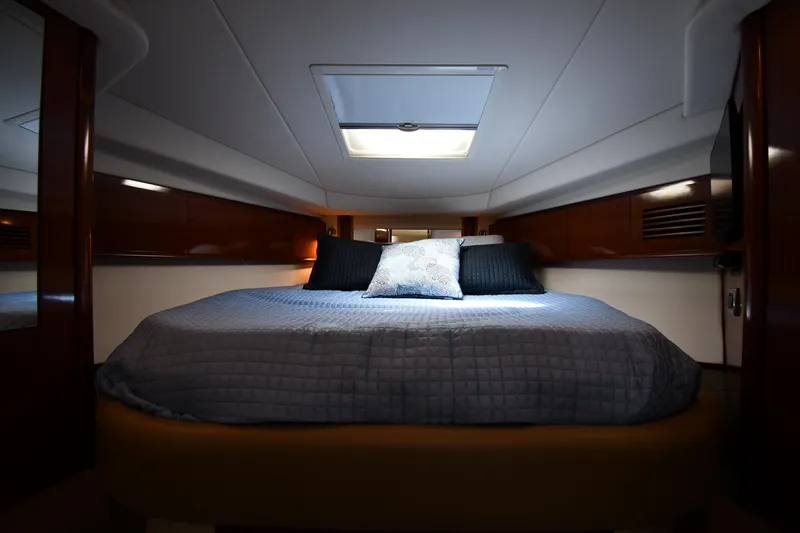 Day Off Yacht Photos Pics Luxurious cabin interior of 2009 Sea Ray 40 Sundancer yacht with cozy bedding.