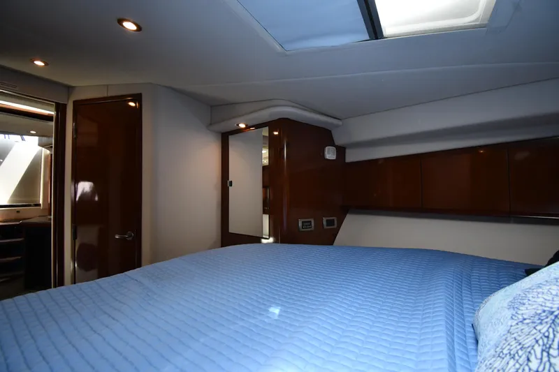 Day Off Yacht Photos Pics Luxurious cabin interior of 2009 Sea Ray 40 Sundancer yacht with blue bedding.