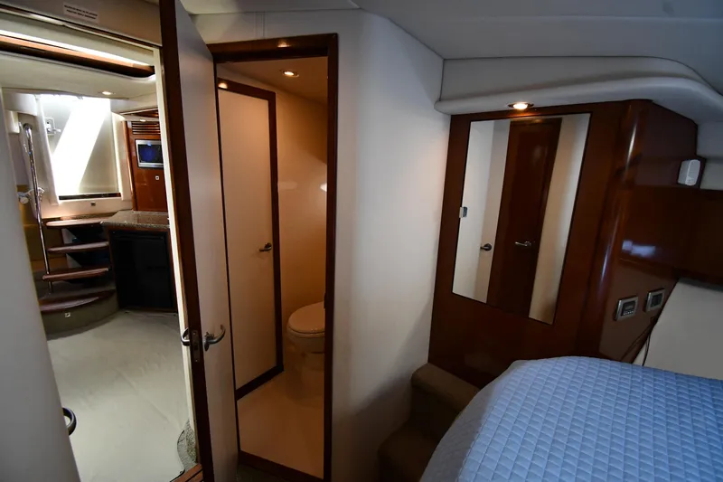 Day Off Yacht Photos Pics Interior of 2009 Sea Ray 40 Sundancer yacht with bedroom, bathroom, and kitchenette.