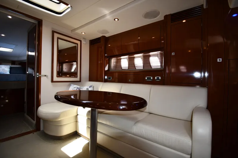 Day Off Yacht Photos Pics Luxurious interior of 2009 Sea Ray 40 Sundancer yacht with elegant seating and table.