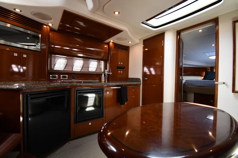 Day Off Yacht Photos Pics Luxurious interior of 2009 Sea Ray 40 Sundancer yacht with modern kitchen amenities.