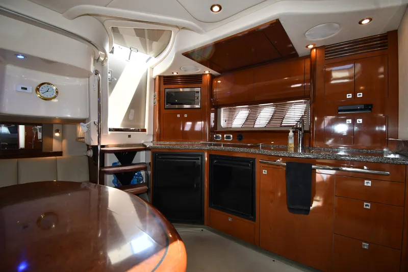 Day Off Yacht Photos Pics Luxurious 2009 Sea Ray 40 Sundancer yacht interior with modern kitchen amenities.