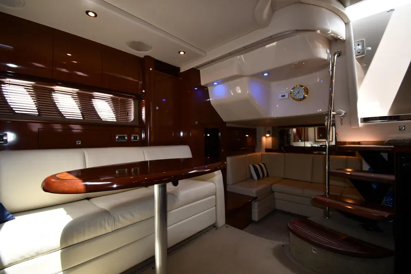 Day Off Yacht Photos Pics Luxurious interior of 2009 Sea Ray 40 Sundancer yacht with elegant seating and wooden finishes.