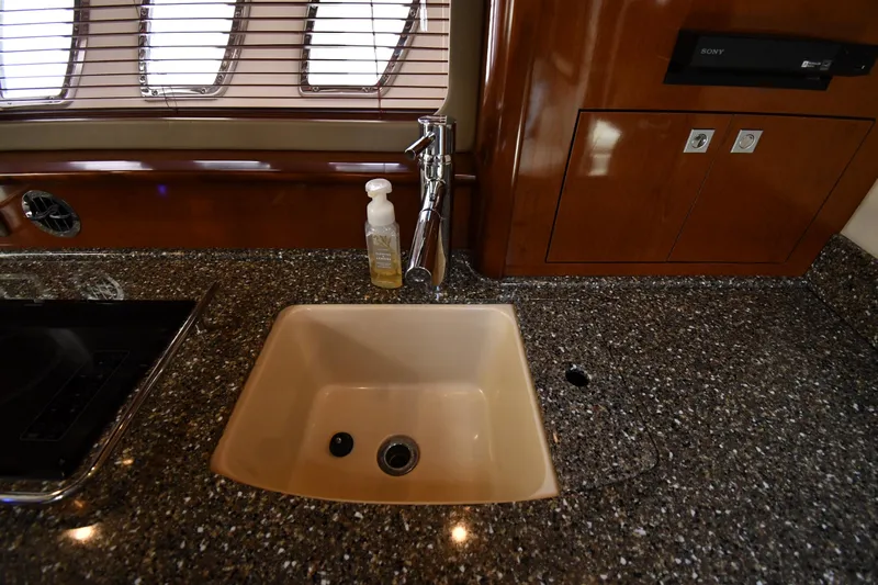 Day Off Yacht Photos Pics Luxurious kitchen sink area on 2009 Sea Ray 40 Sundancer yacht with granite countertop.