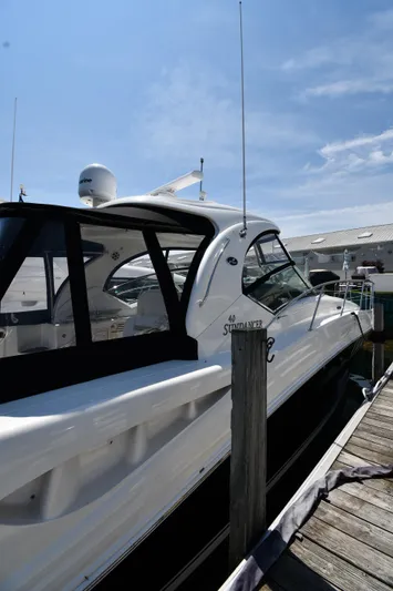 Day Off Yacht Photos Pics 2009 Sea Ray 40 Sundancer yacht docked under clear blue sky.