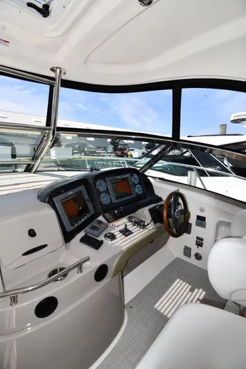 Day Off Yacht Photos Pics 2009 Sea Ray 40 Sundancer helm with modern navigation equipment and steering wheel.