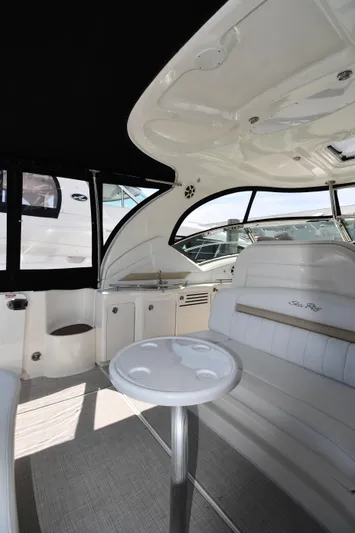 Day Off Yacht Photos Pics Interior of 2009 Sea Ray 40 Sundancer yacht with seating and table.