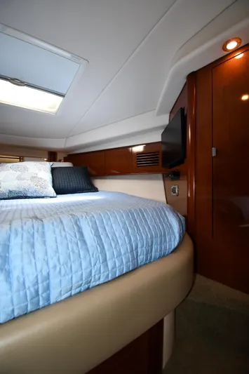Day Off Yacht Photos Pics Luxurious cabin interior of 2009 Sea Ray 40 Sundancer yacht with cozy bedding.