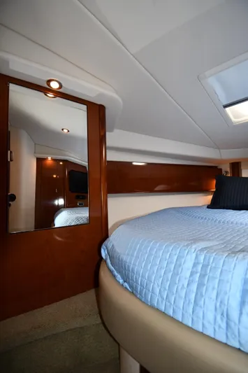 Day Off Yacht Photos Pics Interior of 2009 Sea Ray 40 Sundancer yacht with cozy bed and elegant wood finishes.