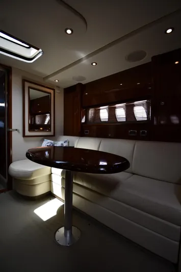 Day Off Yacht Photos Pics Luxurious interior of 2009 Sea Ray 40 Sundancer yacht with elegant seating and table.