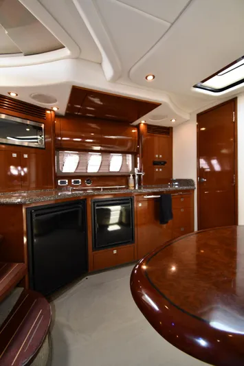 Day Off Yacht Photos Pics Luxurious interior of 2009 Sea Ray 40 Sundancer yacht with modern kitchen amenities.