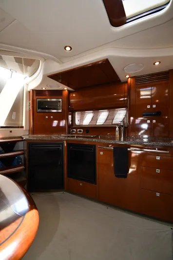 Day Off Yacht Photos Pics Luxurious kitchen interior of 2009 Sea Ray 40 Sundancer yacht with modern amenities.