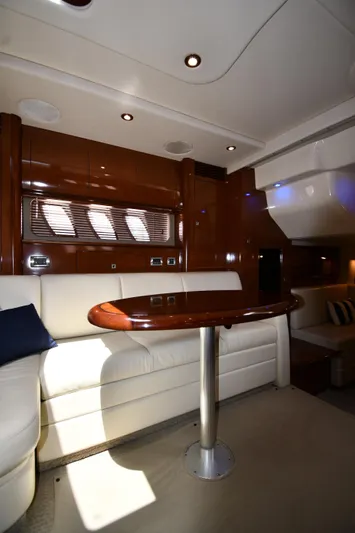 Day Off Yacht Photos Pics Interior of 2009 Sea Ray 40 Sundancer yacht with elegant seating and wooden table.