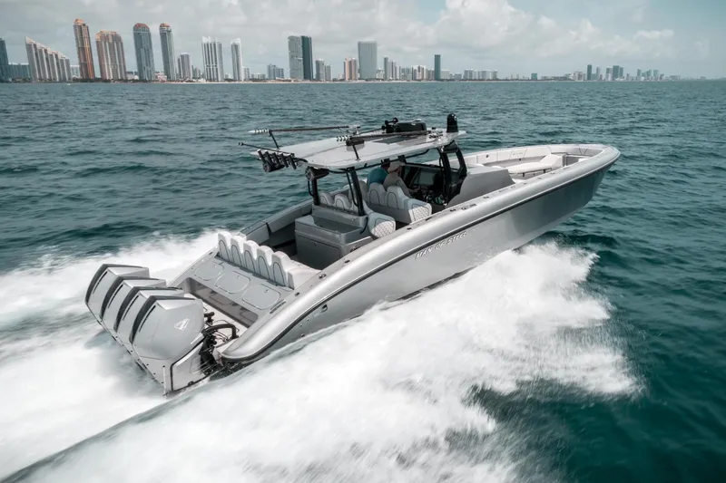  Yacht Photos Pics 2022 Midnight Express 43 Open boat cruising near city skyline on a sunny day.