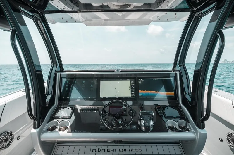  Yacht Photos Pics Cockpit view of 2022 Midnight Express 43 Open boat with advanced navigation displays.