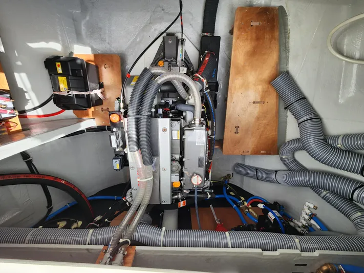 Southern Isle Yacht Photos Pics 2024 Lagoon 46 engine compartment with wiring and hoses.