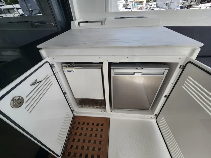 Southern Isle Yacht Photos Pics Interior of Lagoon 46 yacht with refrigerator, 2024 model.