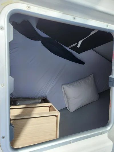 Southern Isle Yacht Photos Pics Interior of 2024 Lagoon 46 with pillow and storage.