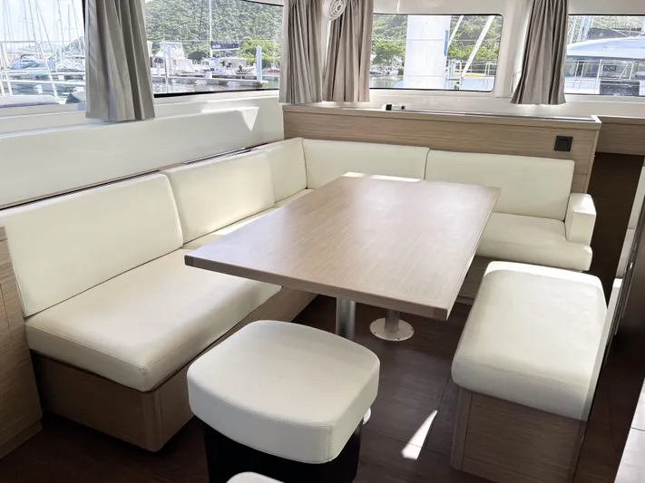 Southern Isle Yacht Photos Pics 2024 Lagoon 46 yacht interior with elegant seating area.