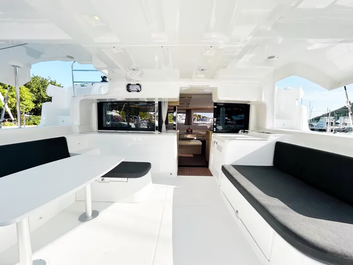 Southern Isle Yacht Photos Pics Spacious interior of 2024 Lagoon 46 catamaran with modern seating.
