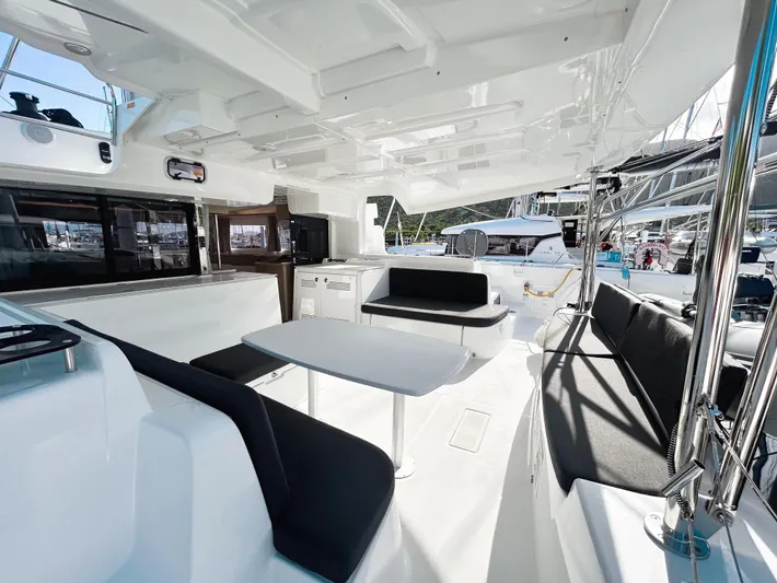 Southern Isle Yacht Photos Pics Interior of 2024 Lagoon 46 yacht with modern seating area.