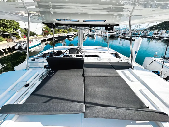 Southern Isle Yacht Photos Pics 2024 Lagoon 46 catamaran in harbor with sun deck.