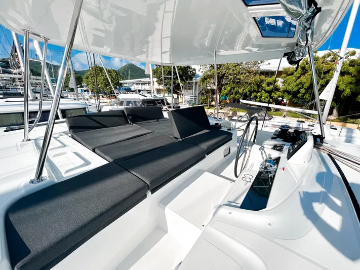 Southern Isle Yacht Photos Pics Luxurious deck of Lagoon 46 yacht, 2024 model, featuring sleek black seating.