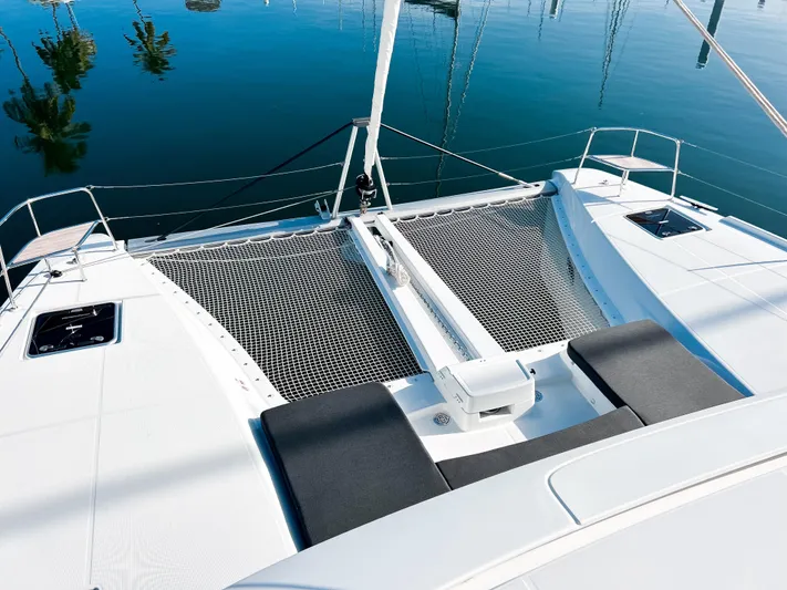 Southern Isle Yacht Photos Pics 2024 Lagoon 46 catamaran with netting and seating area.