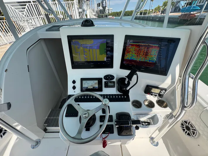  Yacht Photos Pics 2021 Contender 39 Fisharound helm with dual navigation screens and steering wheel.