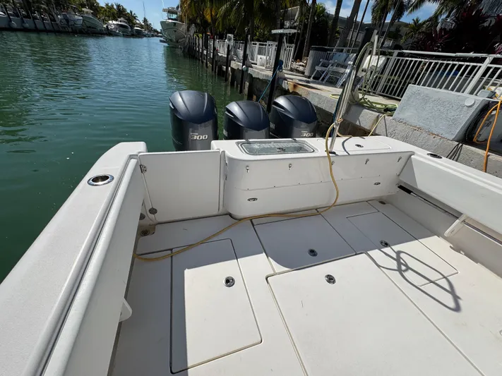  Yacht Photos Pics 2021 Contender 39 Fisharound boat docked with dual outboard engines.