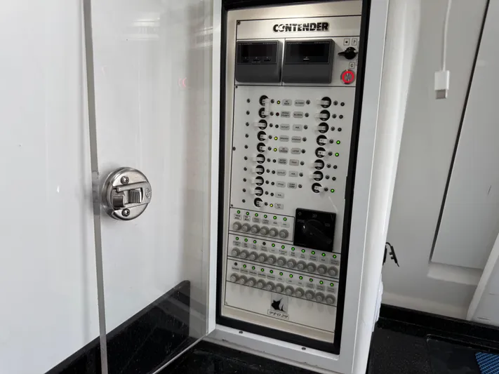  Yacht Photos Pics Electrical panel of 2021 Contender 39 Fisharound boat, featuring control switches and indicators.