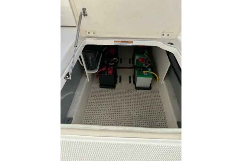 E Komo Mai Yacht Photos Pics 2021 Robalo R317 Dual Console boat battery compartment with organized wiring.