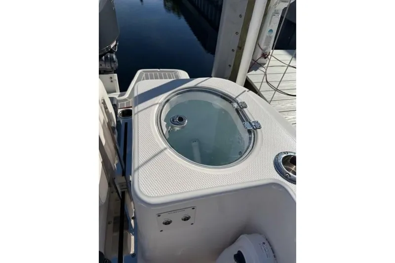 E Komo Mai Yacht Photos Pics 2021 Robalo R317 Dual Console boat with livewell and fishing features.