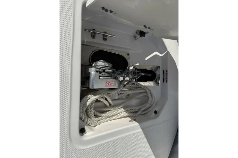 E Komo Mai Yacht Photos Pics 2021 Robalo R317 Dual Console anchor compartment with rope and chain.