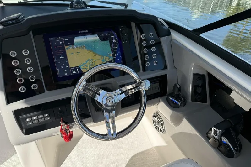 E Komo Mai Yacht Photos Pics 2021 Robalo R317 Dual Console helm with navigation display and controls.