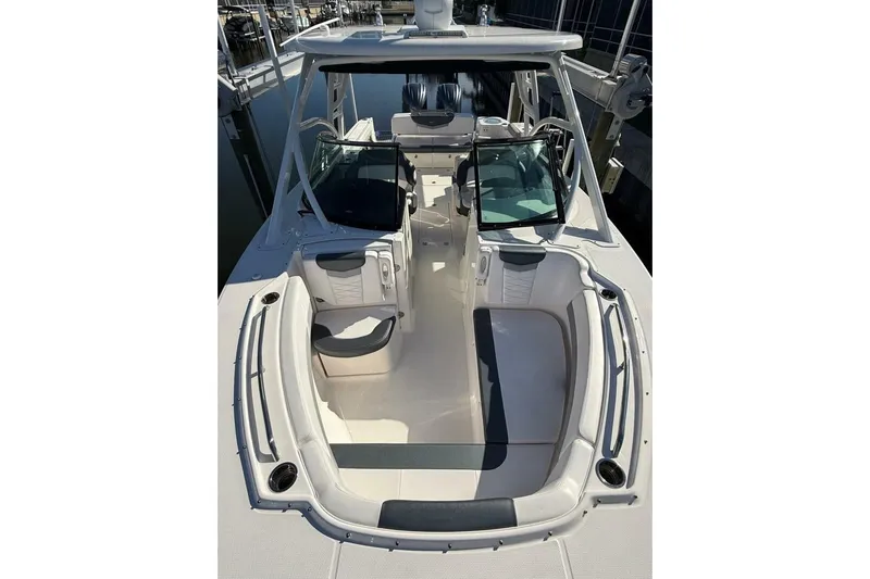 E Komo Mai Yacht Photos Pics 2021 Robalo R317 Dual Console boat interior with seating and open deck layout.
