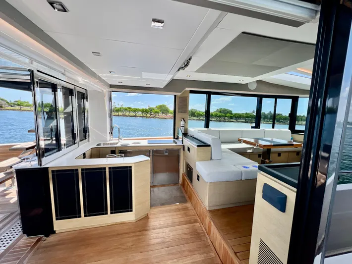  Yacht Photos Pics Interior of 2022 OKEAN Flybridge 50 yacht with modern kitchen and seating area.