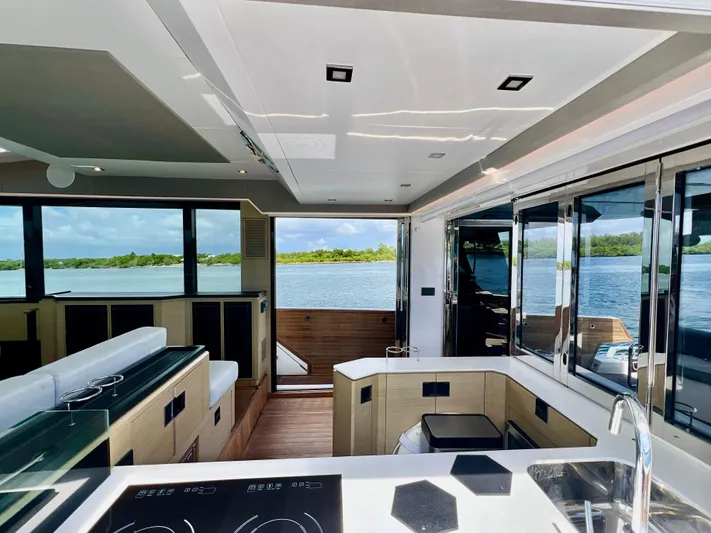  Yacht Photos Pics Interior of 2022 OKEAN Flybridge 50 yacht with modern kitchen and scenic water view.