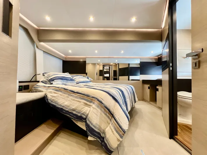  Yacht Photos Pics Luxurious bedroom interior of 2022 OKEAN Flybridge 50 yacht with modern design.