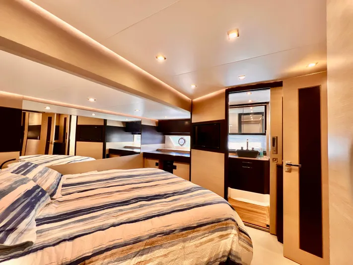  Yacht Photos Pics Luxurious bedroom interior of 2022 OKEAN Flybridge 50 yacht with modern design.