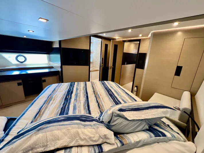  Yacht Photos Pics Luxurious bedroom interior of 2022 OKEAN Flybridge 50 yacht with modern design.