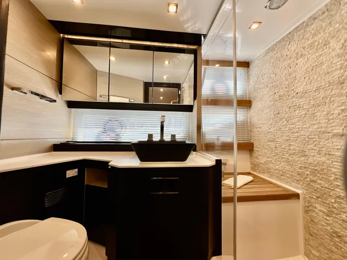  Yacht Photos Pics Modern bathroom in 2022 OKEAN Flybridge 50 yacht with sleek fixtures and ample storage.